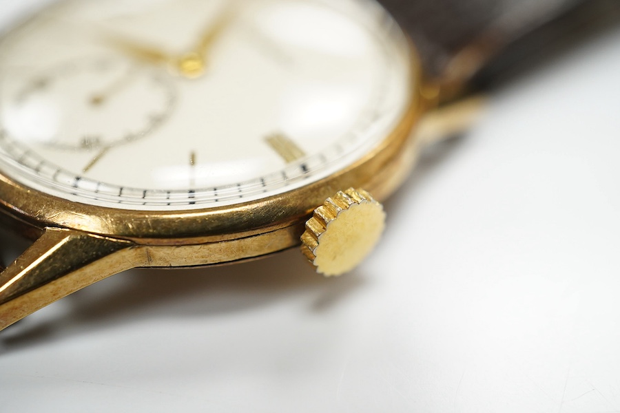 A gentleman's late 1930's 9ct gold Movado manual wind wrist watch, with baton and quarterly numerals and subsidiary seconds, case diameter 29mm, on an associated leather strap. Condition - fair